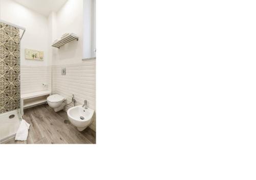 a bathroom with a toilet and a sink at b&b don Mimì in Naples