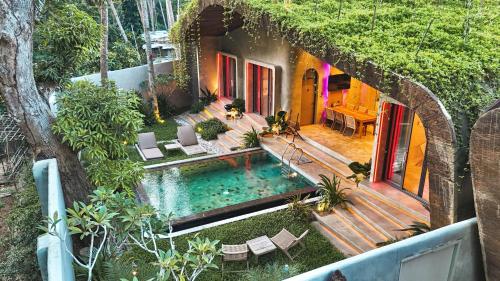 an aerial view of a house with a swimming pool at Diwatu Villas in El Nido