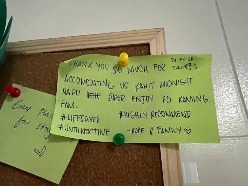 a note attached to a wall with writing on it at Brittany Bliss Staycations at SMDC HOPE RESIDENCES in Trece Martires