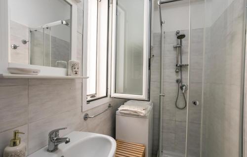 a bathroom with a sink and a shower at Residenza Flamingo in Marzamemi