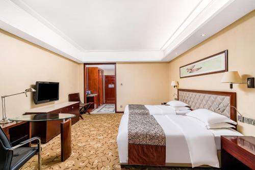 TV a/nebo společenská místnost v ubytování Langfang Arcadia International Hotel