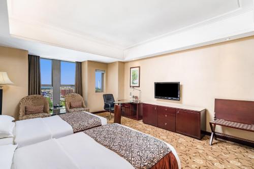 TV a/nebo společenská místnost v ubytování Langfang Arcadia International Hotel