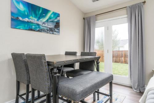 a dining room with a table and chairs at Peaceful Modern Home near Avon in Avon