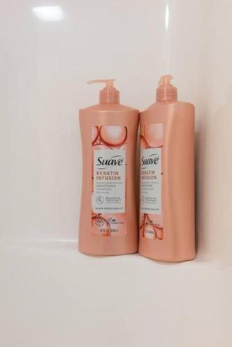 two bottles of sunscreen sitting on a shelf at Peaceful Modern Home near Avon in Avon