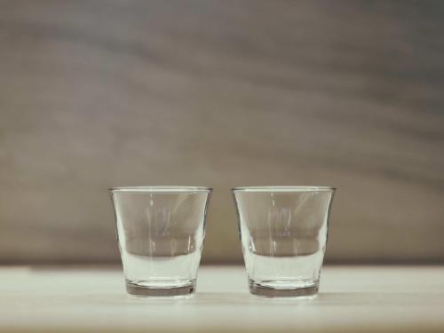 two glasses of water sitting on a table at illi Gran Azabujuban in Tokyo