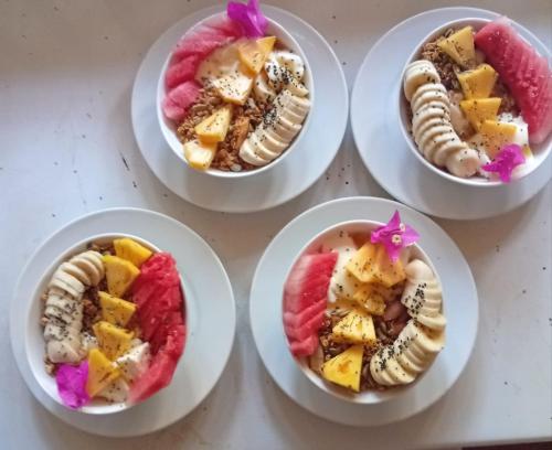 a group of four plates with different types of desserts at Hotel Coral Bay in Trincomalee