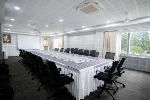 a large conference room with a long table and chairs at Bhutan Peaceful Residency and Spa in Thimphu
