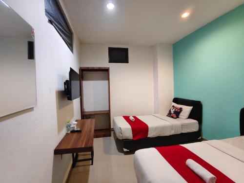 Cama o camas de una habitación en YUTAKA INN Tunjungan Surabaya