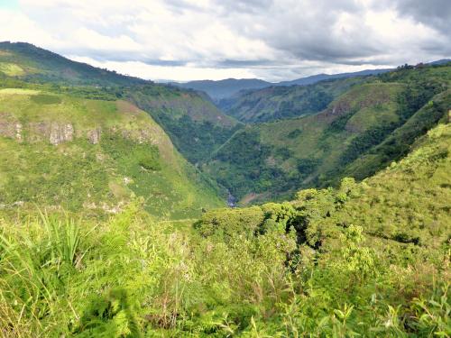 a view of a valley in the mountains at Finca El Cielo in San Agustín