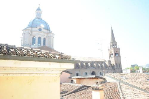a view of a cathedral and buildings with roofs at La Mainolda B&B in Mantova