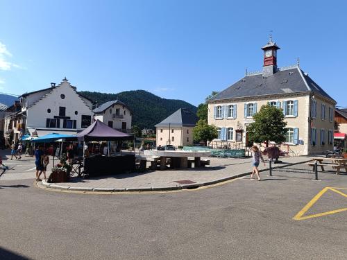 a group of people walking around a street in a town at Studio Villard-de-Lans in Villard-de-Lans
