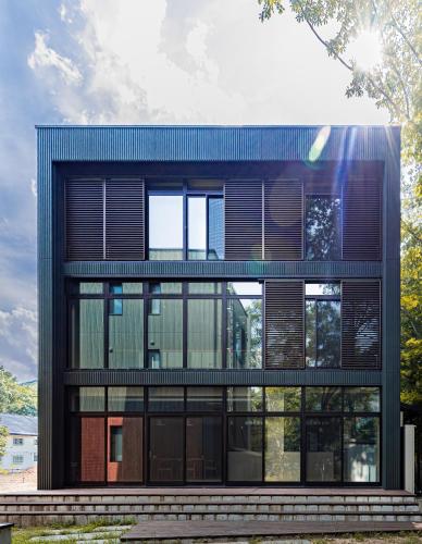 a large building withwindows and a blue roof at SUKH Hakuba Chalet by Jade Villa in Hakuba