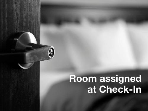 a room assigned at check in written on a wooden door at Stay Express inn and Suites Atlanta Union City in Union City