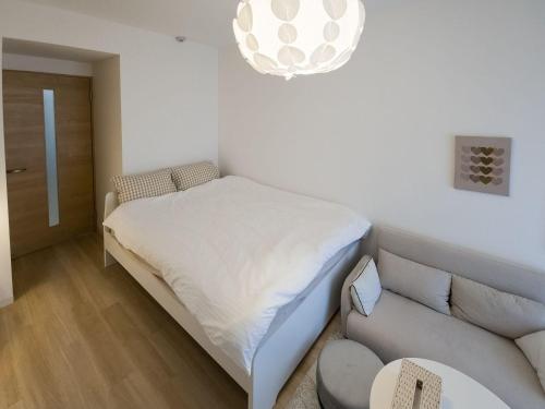 Postel nebo postele na pokoji v ubytování Suke Home Oshiage