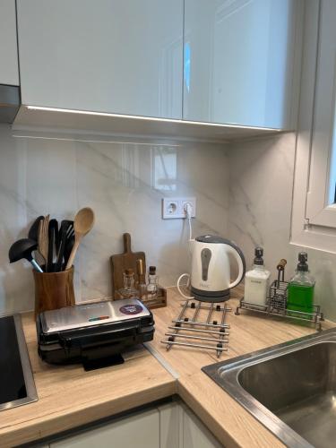 a kitchen counter top with a toaster and a toaster at KK Athens Fine Stay-Steps to Metro-Modern & Cozy Apartments in Athens
