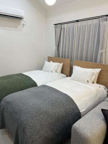Postel nebo postele na pokoji v ubytování COFFEE HOTEL Soundwave