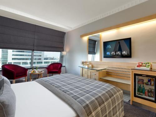 Cama o camas de una habitación en Metropolitan Hotels Ankara