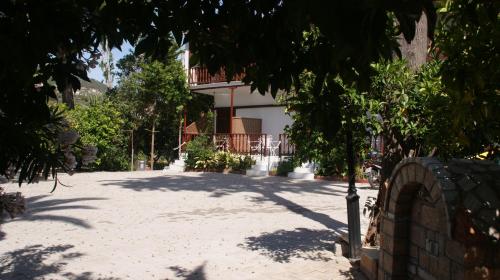 a house with a driveway in front of it at Villa Christina in Tolo