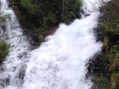 a waterfall on the side of a mountain at Berghaus Außergschlöß in Matrei in Osttirol