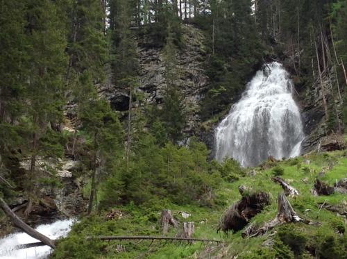 a waterfall in the middle of a forest at Berghaus Außergschlöß in Matrei in Osttirol