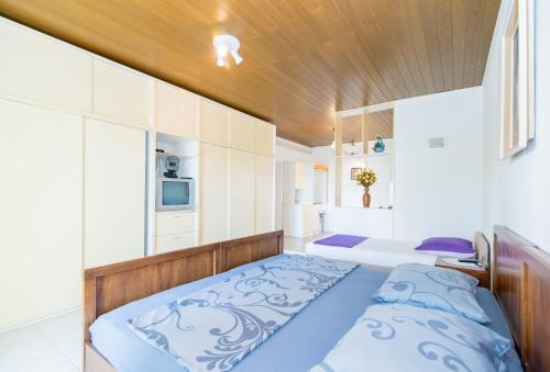 Ένα ή περισσότερα κρεβάτια σε δωμάτιο στο Apartments Veve