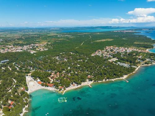 an aerial view of a small island in the ocean at Ilirija Resort Hotel Kornati in Biograd na Moru