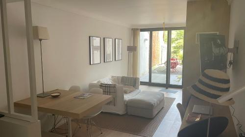 a living room with a couch and a table at The Refuge of Happiness in Bouillon