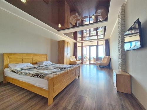 Postel nebo postele na pokoji v ubytování VIP Apartments Sovinion