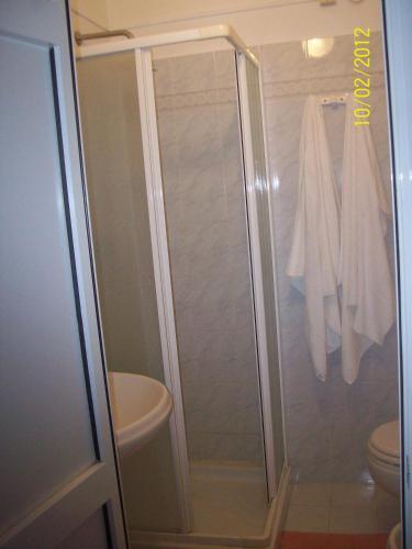 a shower in a bathroom with a toilet at Albergo La Perla in Orbetello