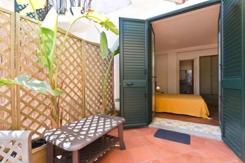 a room with a bedroom with a bed in it at Sirami Apartments in Taormina