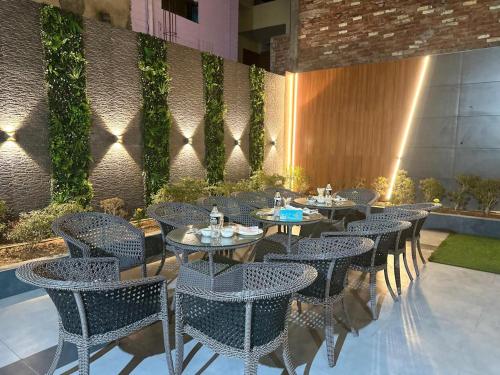 a row of tables and chairs in a restaurant at Luxury 3bhk villa (mere bebe da villa)@gopal nagar in Jalandhar