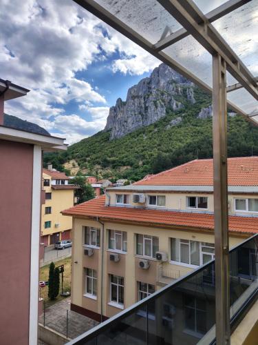 a view from the balcony of a building with a mountain at Апартамент Светли in Vratsa