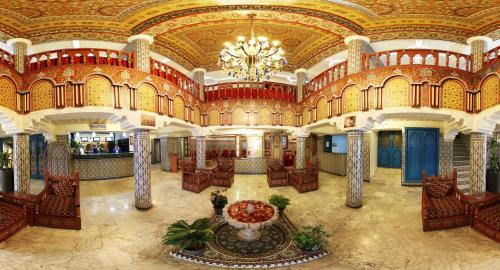 a large lobby with a chandelier in a building at Hotel Moroccan House Casablanca in Casablanca