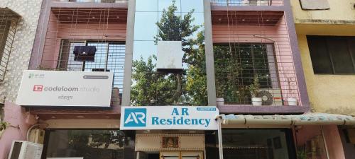 an art residency sign in front of a building at Hotel O A R Residency in Koparpāda