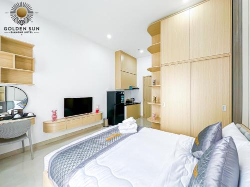 a bedroom with a large bed and a tv at Golden Sun Hotel Apartments 5 in Ho Chi Minh City