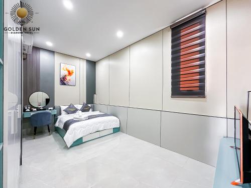 a bedroom with a bed and a desk at Golden Sun Hotel Apartments 5 in Ho Chi Minh City