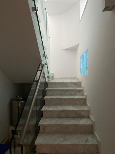 a staircase in a building with a stair case at Habibi-Danydan La Chebba in Chebba