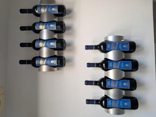 a bunch of bottles of wine in a wine rack at Giaro's Home in Pompei