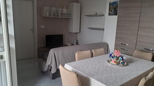 a kitchen with a table and a dining room at Giaro's Home in Pompei