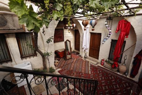 a hallway of a building with clothes hanging on the wall at Hanzade Cappadocia in Goreme