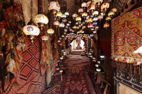 a room filled with lots of chandeliers and many lights at Hanzade Cappadocia in Goreme