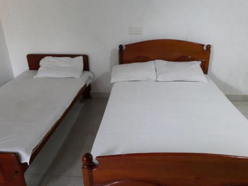Cama o camas de una habitación en Sajee Residence Trincomalee
