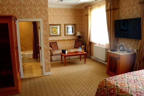 a hotel room with a bed and a bathroom at Terelj Hotel & Spa in Ulaanbaatar