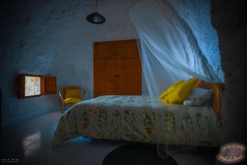 Postel nebo postele na pokoji v ubytování Casas y Cuevas El Solins