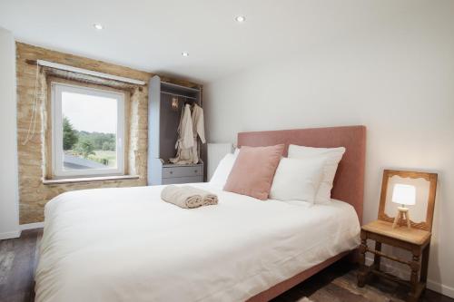 Una cama o camas en una habitación de Gîte Saint-Roch