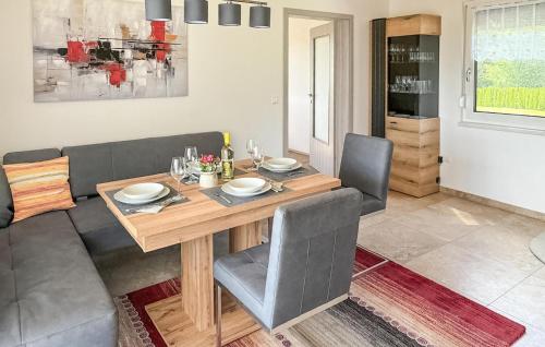 a dining room with a wooden table and chairs at 2 Bedroom Nice Home In Kirchfidisch in Kirchfidisch
