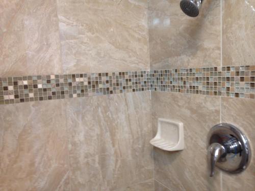 a bathroom with a shower with a toilet in it at Morro Crest Inn in Morro Bay