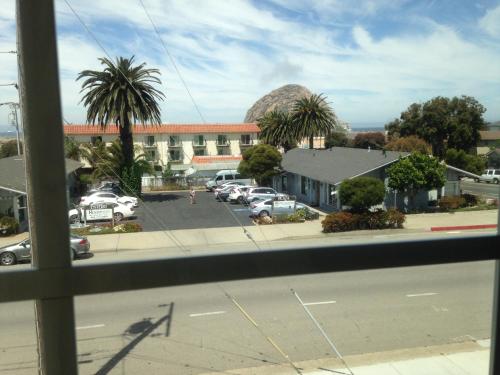 a view from a window of a parking lot at Morro Crest Inn in Morro Bay