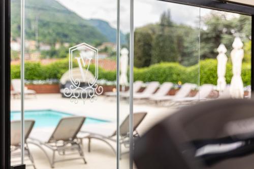 a view of a patio with chairs and a pool at Villa Vitali - Bellagio in Bellagio