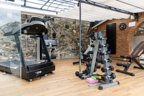 a gym with a treadmill and exercise equipment at Villa Vitali - Bellagio in Bellagio